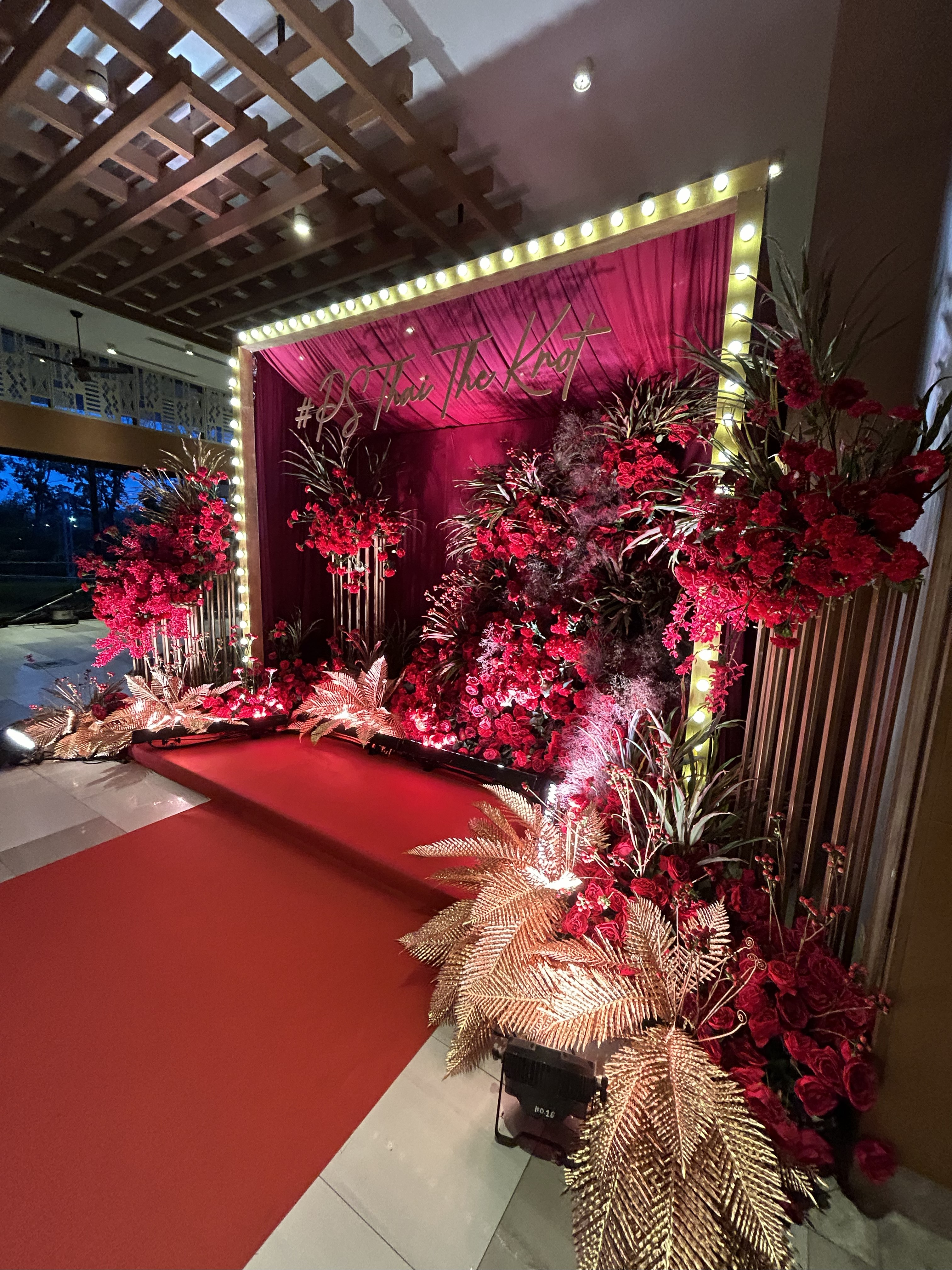 Indian engagement party backdrop with marigold decorations